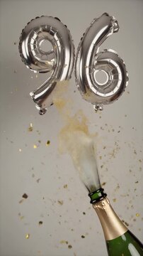 Number 96 balloon with popping champagne bottle. Celebrating a milestone, anniversary or birthday