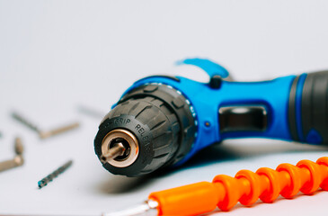 Working with a power drill and tools on a simple workspace for home projects