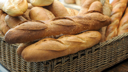Artisan baguettes piled high in rustic basket your next meal or bakery advertisement campaign