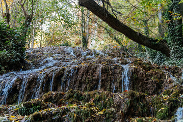 Water cascading over mossy rocks in Monasterio de Piedra