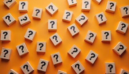 Scattered wooden blocks with black question marks on vibrant orange surface. Represents queries, confusion, problems, and need for answers. Suitable for business, education, and creative concepts.