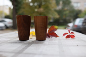 Elegant handmade wood water glass or wooden cup isolated on white background.