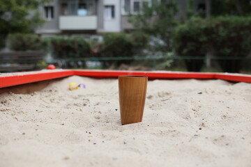 Elegant handmade wood water glass or wooden cup isolated on white background.