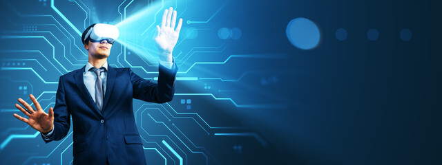 Businessman using VR headset interacting with virtual interface background in futuristic digital environment with glowing blue light effects.