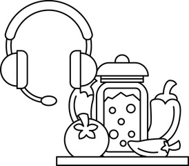 A jar of food is on a table next to a headset