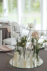Elegant Wedding Table Decoration with Flowers and Candles
