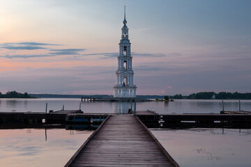 The flooded bell tower of St. Nicholas Cathedral rises above the surface of the Volga River. Kalyazin, Tver region.