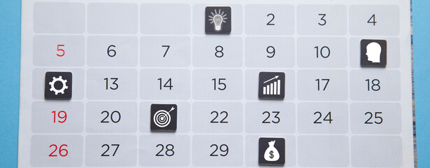 Goals and business icons on calendar.