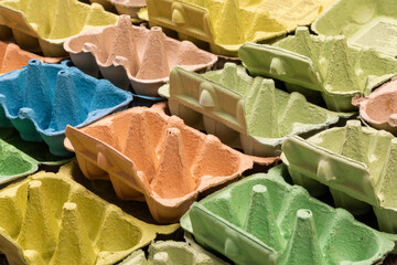 Colourful empty egg boxes open