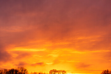 Dramatic Golden Hour Sunset Sky with Vibrant Orange and Red Clouds