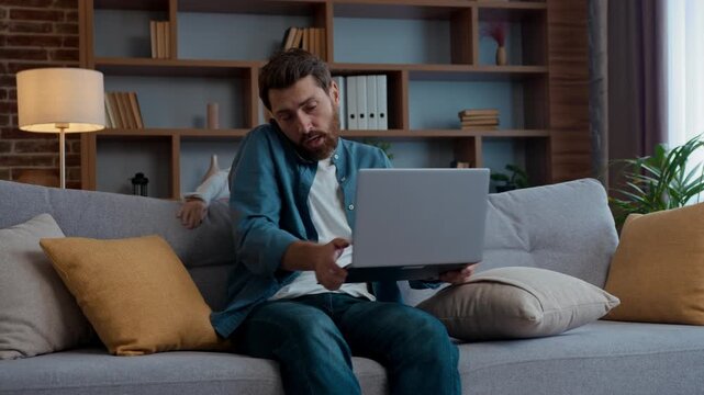 Family at home quarantine little noisy girl distract father from freelance job talking mobile phone using laptop multitask remote busy work active funny daughter child kid jumping around distracting