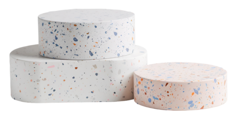 Three stone podiums with pastel flecks sit in a stacked arrangement against a transparent background. They are suitable for showcasing products or decor items in various settings