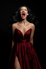Woman yells with intense emotion while wearing a deep red dress in a dark setting