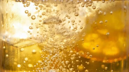 fizzy drink or soda in glass with ice and bubbles refreshing cold beverage macro close up for summer thirst - Powered by Adobe