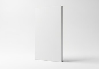 Naklejka premium Blank white vertical rectangular object stands on a light surface with soft shadows