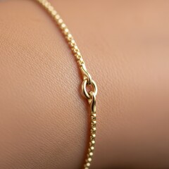 Macro detail of a seamless permanent gold bracelet welded onto a wrist.