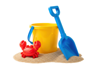 a clean, glossy yellow bucket and blue shovel with a small red crab figurine rest on fine tan sand against a transparent studio background, commercial summer fun concept
