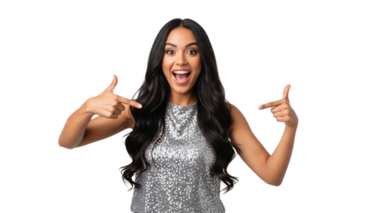 Young multi-ethnic woman with glossy dark wavy hair wearing a silver sequined top, smiling vibrantly and pointing outwards against a high-key white studio. Concept for promotional advertising
