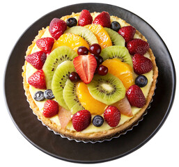 fresh fruit cake top view on a black plate