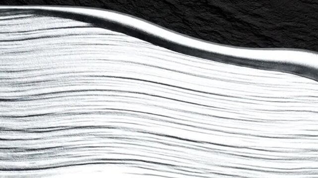 Silver waves flow a dark horizon