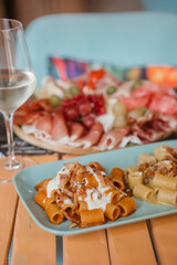 Elegant Italian aperitif with prosecco and warm gourmet dishes