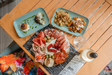 Elegant Italian aperitif with prosecco and warm gourmet dishes