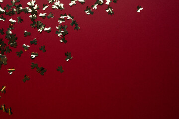 Gold angel-shaped confetti adorns a deep purple background, with a clean, designated space for custom text.  Exhibition displays, festive greeting cards, and high-end holiday promotions.