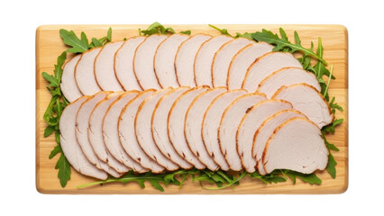 Isolated platter of sliced roasted turkey breast meat with fresh greens, elegant presentation