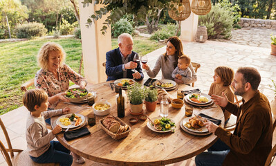 Happy family during garden lunch