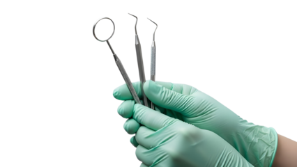 Dental professional hands in protective green gloves holding three metallic dental tools isolated on white background