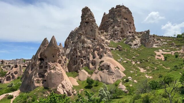 Goreme, Turkey, May 8, 2024: Uchhisar Fortress city. The famous Uchhisar Cave Castle in Cappadocia. The big stone town of Uchkhisar in hot summer weather. 4K
