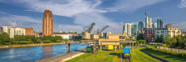 Frankfurt Skyline with Historic Westhafen Cranes, River, and Modern Architecture in Sunny Light