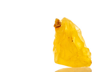 Bright golden sweet raisins isolated on white background, macro.