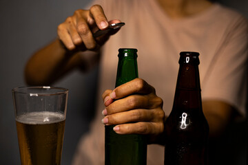 Woman Opening Beer Bottle With Opener