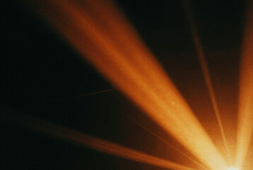 Bright light shines brightly against a dark background.