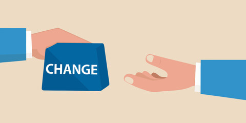 Hands exchanging a blue cube with the word change written on it