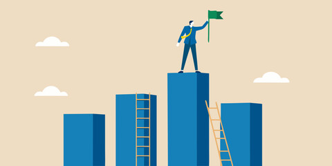 A successful businessman plants a flag atop a growing bar graph