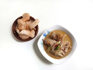 Lontong Sayur Padang, Vegetable Curry with Rice Pressed Cake, Served with Jack fruit vegetable and crackers, isolated on white background, Copy Space for Text