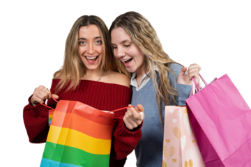 Happy young women opening shopping bag after retail therapy