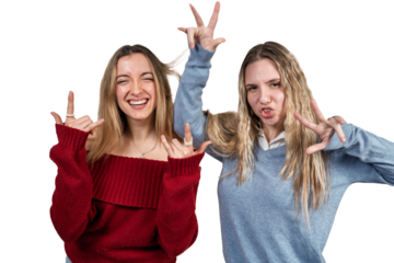 Two young women friends posing making hand gestures