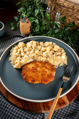 Minced meat cutlet with boiled sauerkraut.
