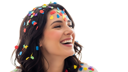 A smiling woman is showered with colorful confetti, expressing pure joy and happiness. The confetti adds a touch of festivity to the scene.