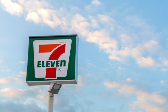 Bangkok, Thailand - December 9, 2025 : 7-Eleven Convenience store sigh with blue sky background. 7-Eleven is the world's largest convenient store franchise.