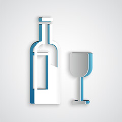 Paper cut Wine bottle with glass icon isolated on grey background. Paper art style. Vector