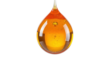 Isolated golden amber drop with air bubbles glistening, dripping with viscous liquid substance