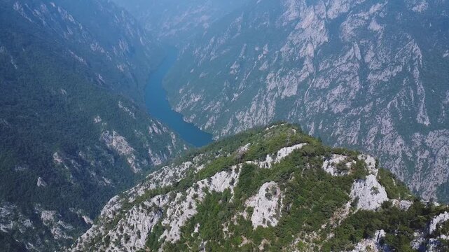 Stunning aerial panorama of the Drina River Gorge winding through steep, forested mountains in Tara National Park, a popular Serbian landmark