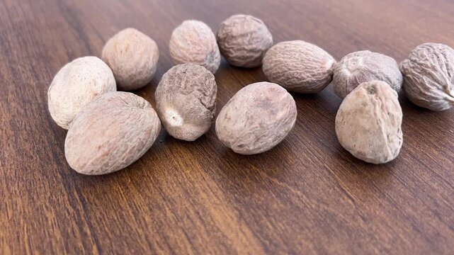 Nutmegs Placed on Table Close Up for Spice and Cooking Concept 4K Video