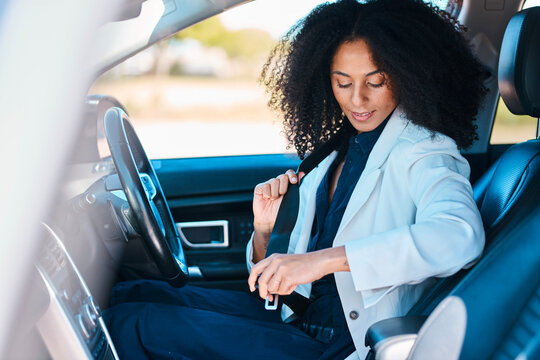 Professional Woman In Car Adjusting Seatbelt Inside Modern Vehicle For A Busy Day At Work - Powered by Adobe