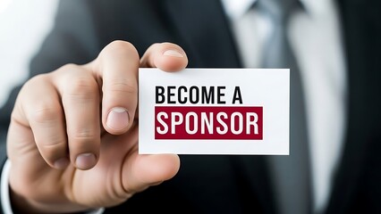 Businessman Holding "Become A Sponsor" Card - Corporate Partnership and Funding Concept