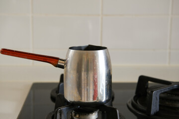 Turkish coffee pot on the cooking stove